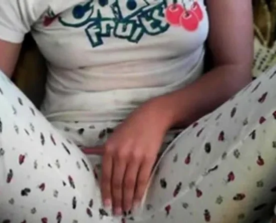 Amateur girl rubs her pussy through pajamas