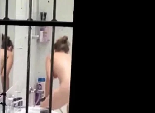 Neighbour caught naked in bathroom