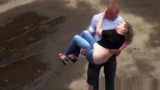 woman peeing in the parking