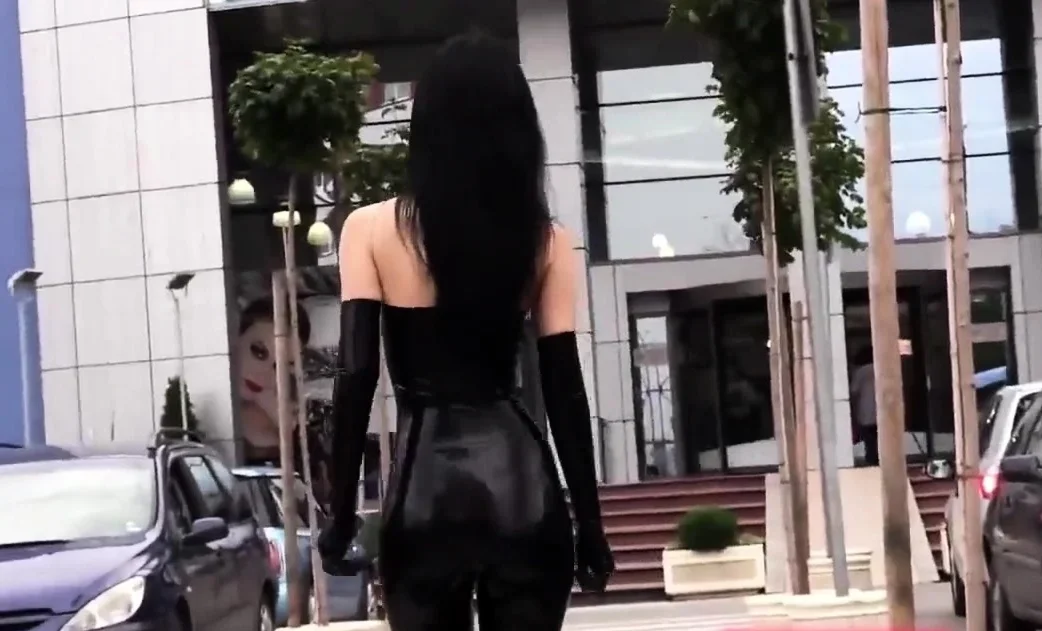 Ultra sexy goth girl wearing black lipstick in public