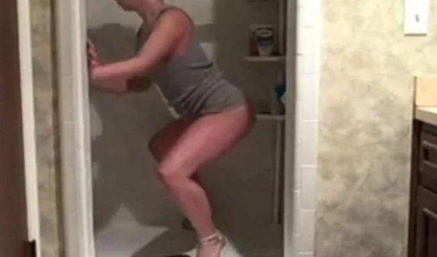 Hot milf cleaning the shower showing her ass