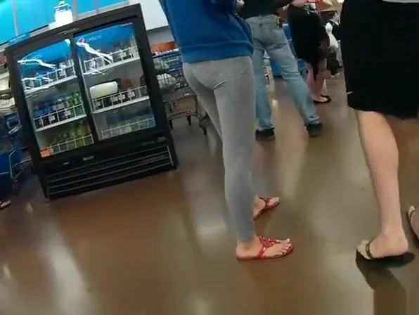 Nice ass girl in gray leggings at the supermarket