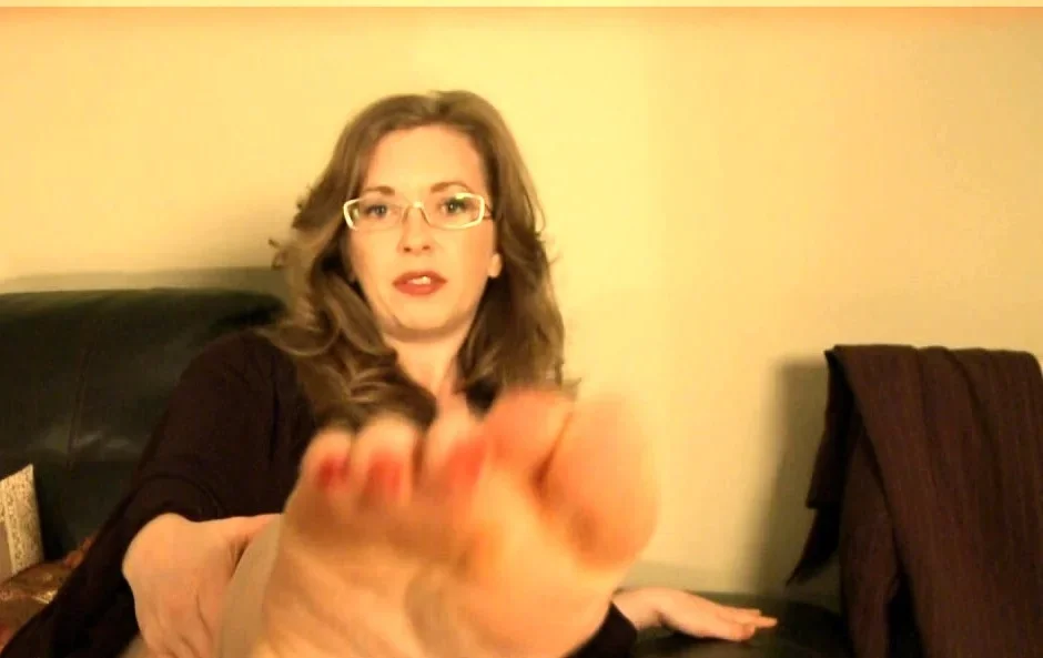 Brunette with foot fetish rubs big dick with her feet in POV