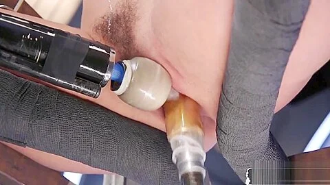 Restrained babe cumming during machine sex