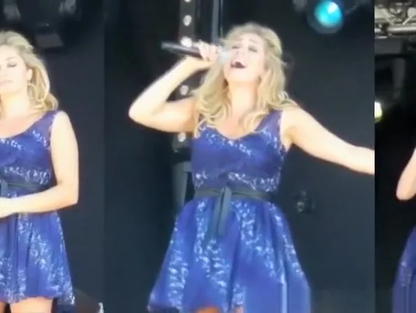 Wind lifts singer dress exposing her panties