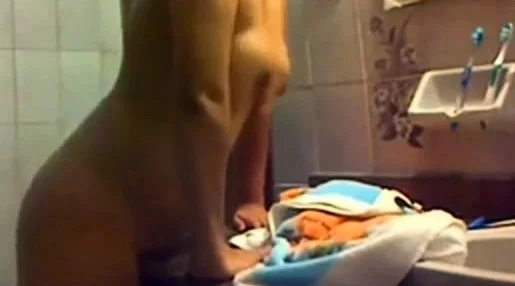 Tanned girl grindingnher pussy on the sink