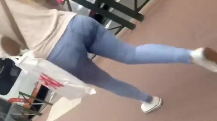 follows a casually dressed girl