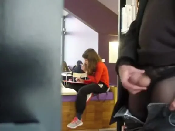 Rubbing the penis in the library
