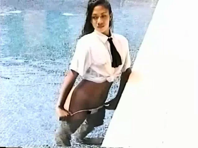 Janice poses in the pool letting you see her nice ass and bush
