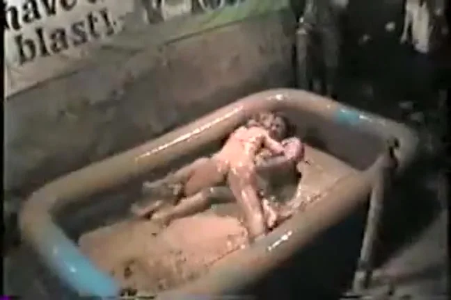 Mud wrestling girls at the bar make a sexy mess