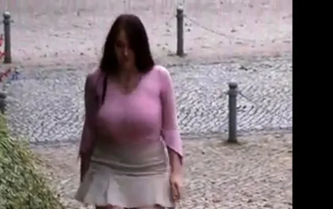 Busty girl walking, no bra, jiggling