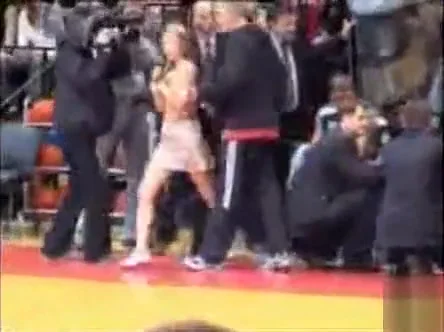 Topless girl streaks at a basketball game