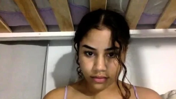 Latin teen smokes cigarette in lingerie