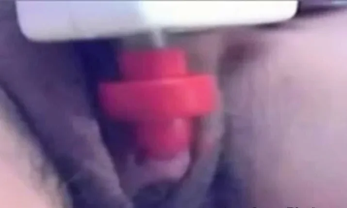 a woman pumps her clit into a dick