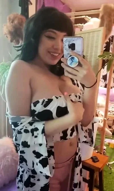 Busty babe playing with her big boobs