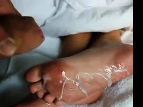 Huge load of cum over Mary's sexy feet soles!