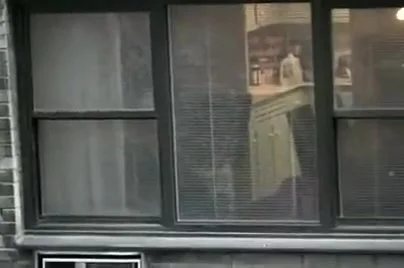 Topless neighbor girl in a window peep