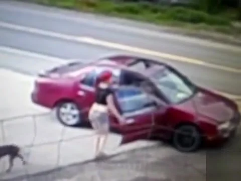 Pink haired girl pisses on the side of the highway