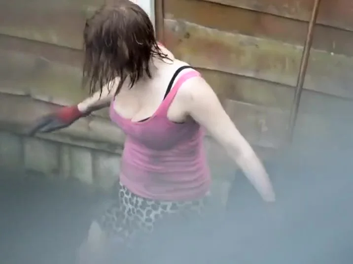 Neighbor lady cleans in the yard