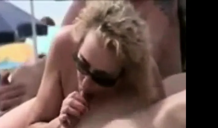 girl sucks husband's dick on the beach