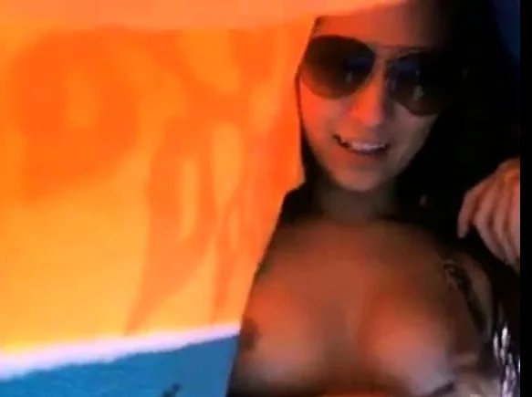 Girl showing tits outdoor by the pool