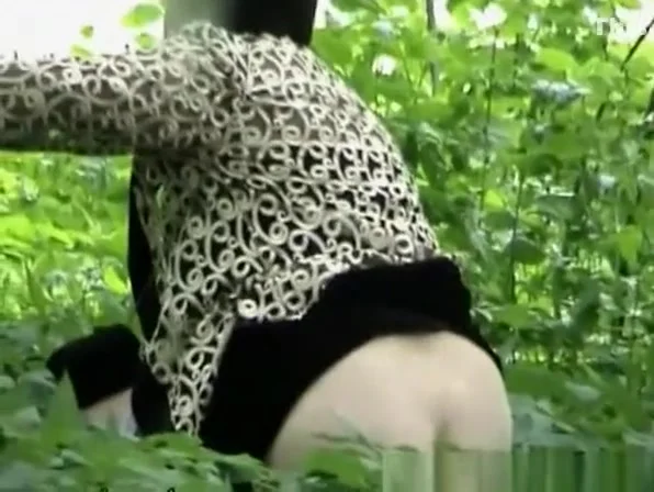 Woman peeing after another