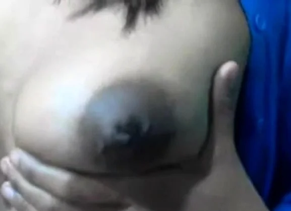 Squeezes out milk from her dark nip ttis