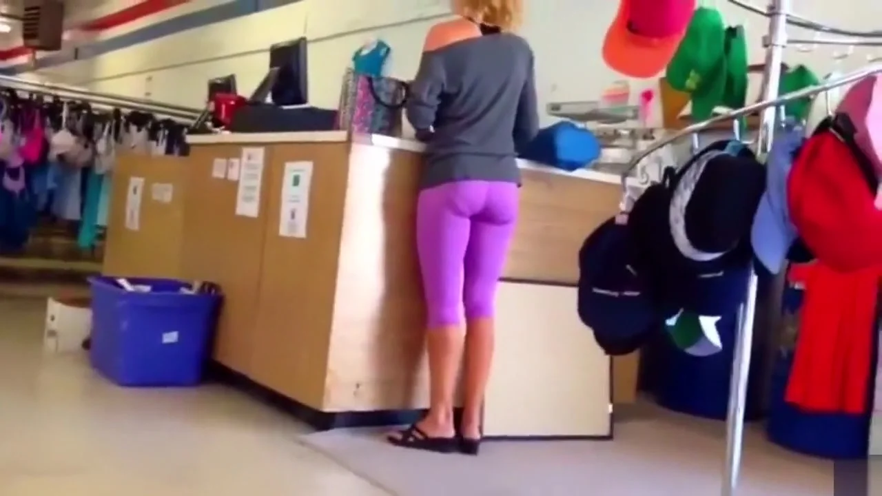 Blonde shopaholic in pink sweatpants gets her behind taped