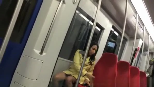 Sexy brunette upskirted in metro sairs