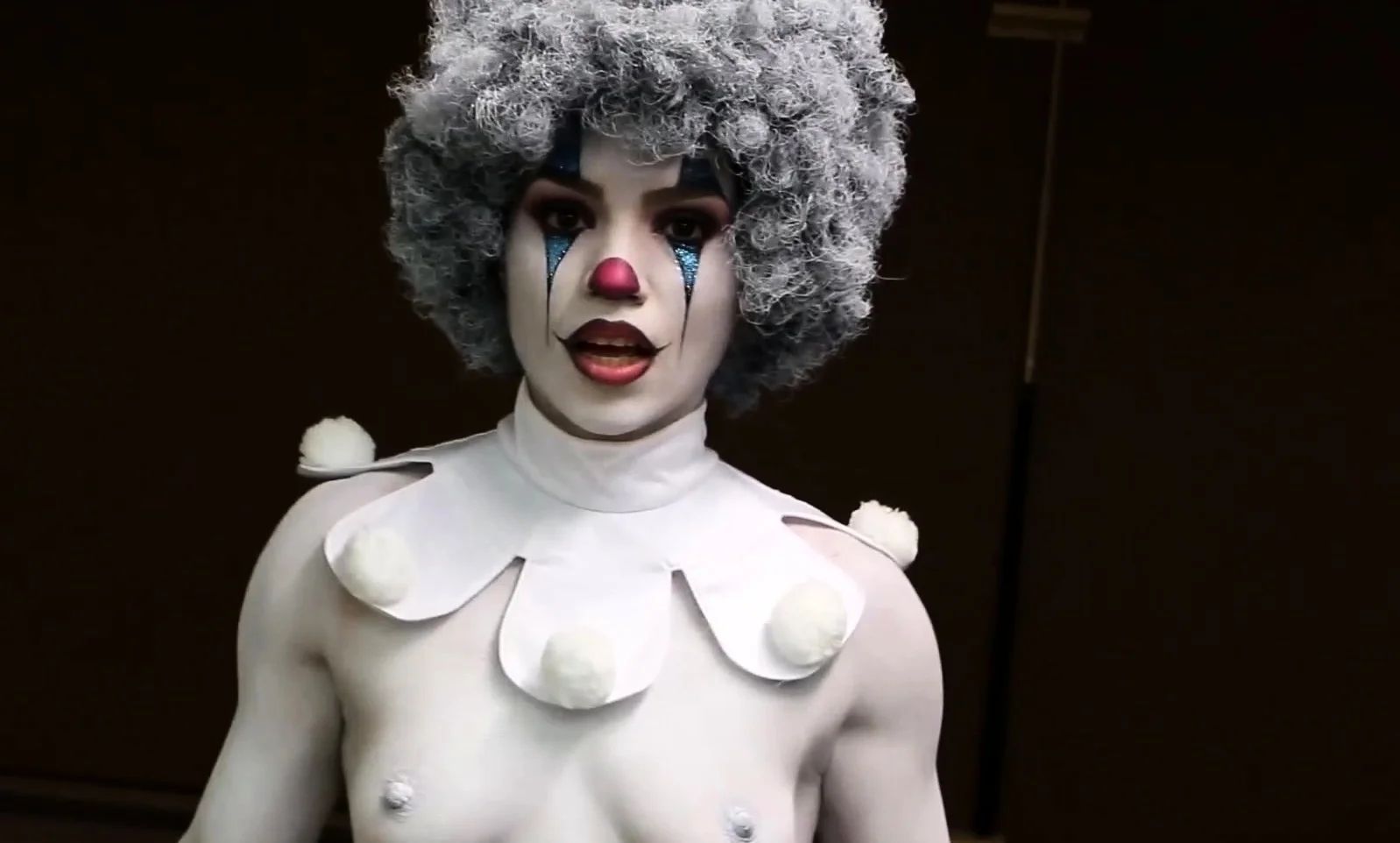 A clown dressed babe teasing amateur style