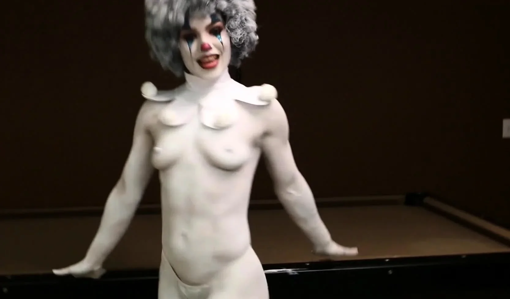 A clown dressed babe teasing amateur style