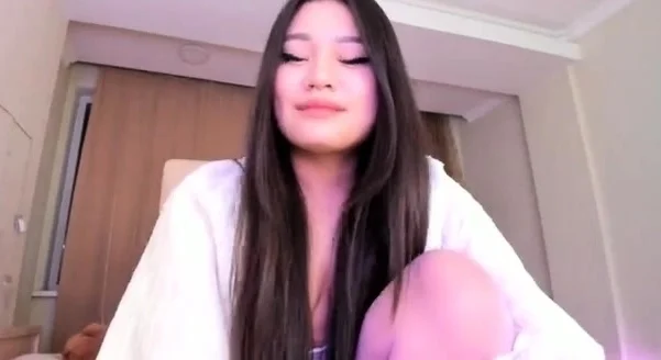 Shaved Asian milf squirting while masturbate on webcam