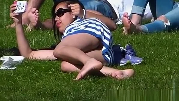 Look under the skirt of a girl lying on the grass