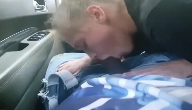 AMATEUR BLONDE SUCKING A BIG BLACK COCK IN A CAR