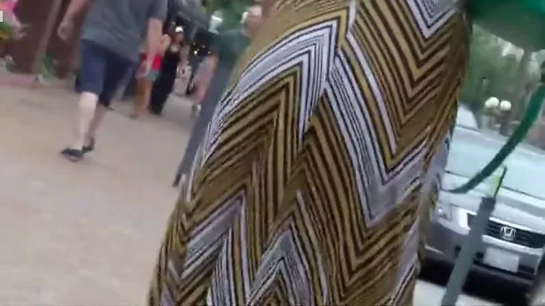 Sexy babe walks by a construction yard