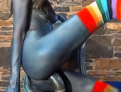 Sexy chick with body ink riding huge dildo