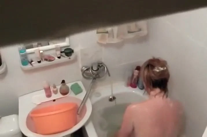 Hot woman washes in the bathtub