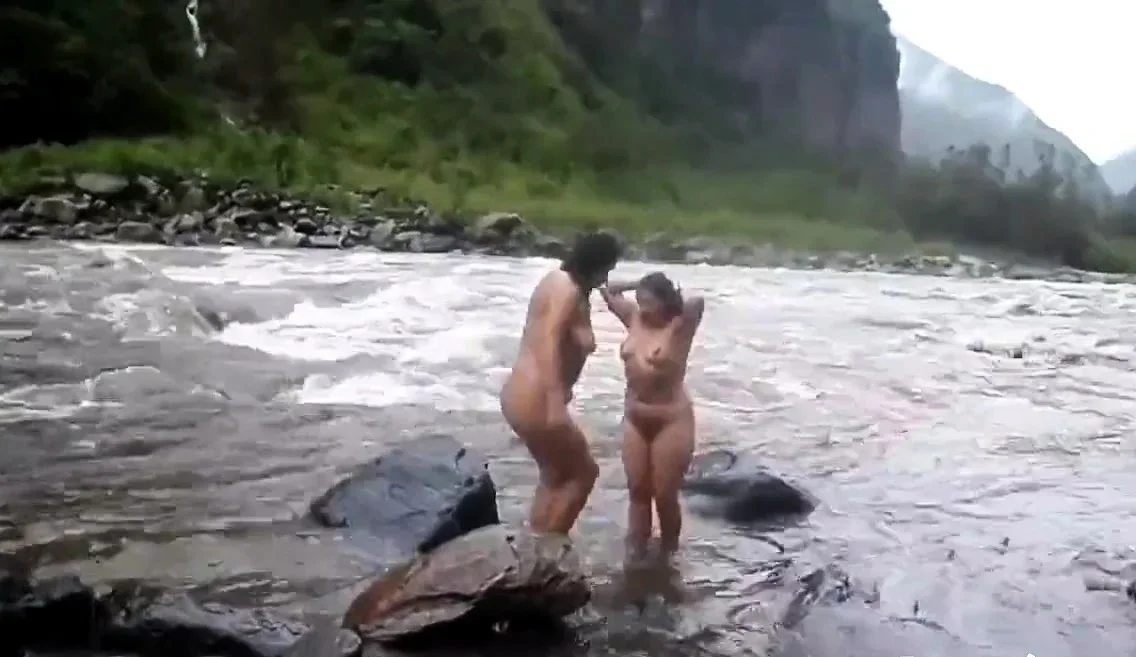 Two indian mature womens  bathing in river naked