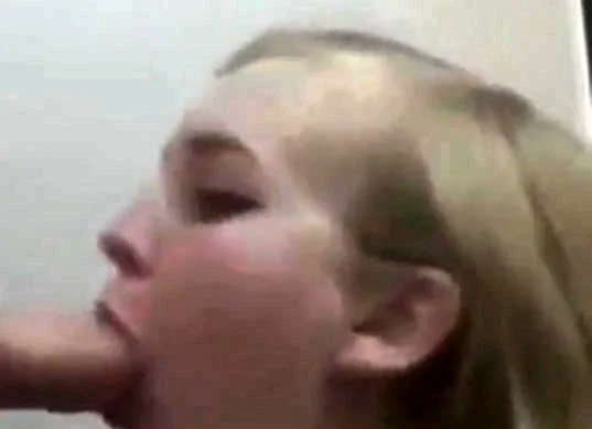 Blonde college girl gives a blowjob on her knees
