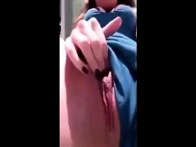 Slut masturbates on a deckchair