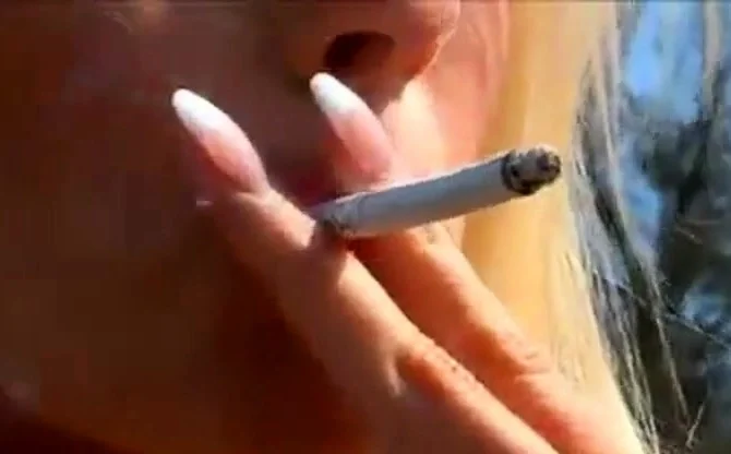 Sexy UK Blonde In Leather Smoking