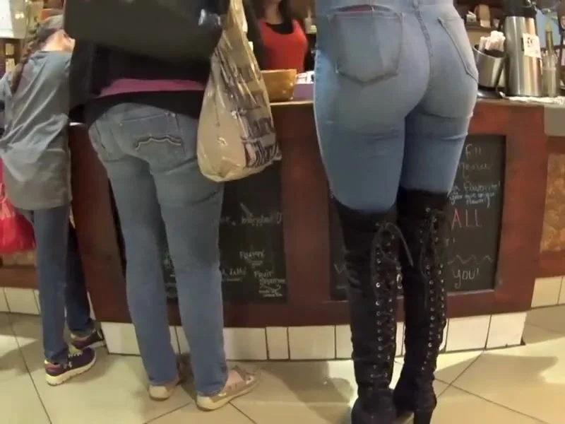 Perfect girl in tight jeans and high boots
