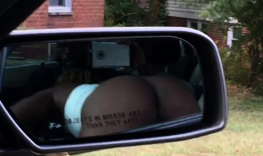 Black slut sucking dick in front seat of car