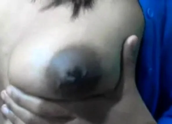 Squeezes out milk from her dark nip ttis