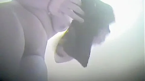 Woman uncovering her nub slit on in change room