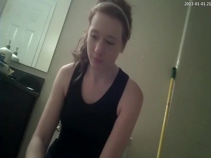 Ginger girl is spied while taking a piss
