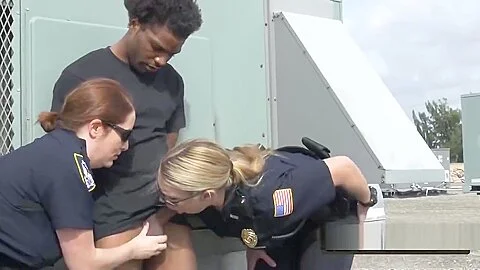 Busty cops take peeping tom to a rooftop when caught spying on white women