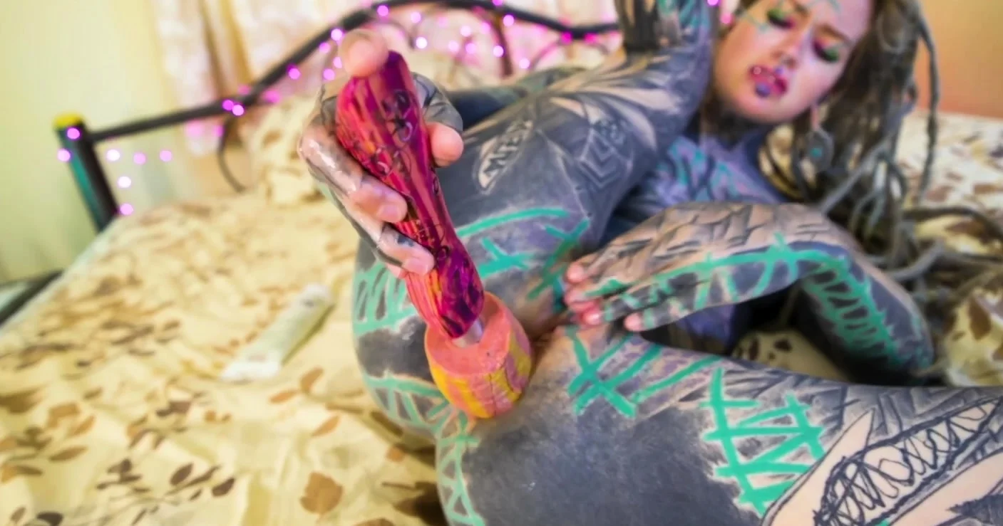 Tattooed girl fingering her pussy and ass