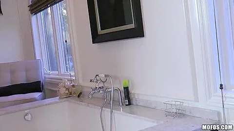 Gorgeous buxom goddess Ashley Roberts plays with water jet