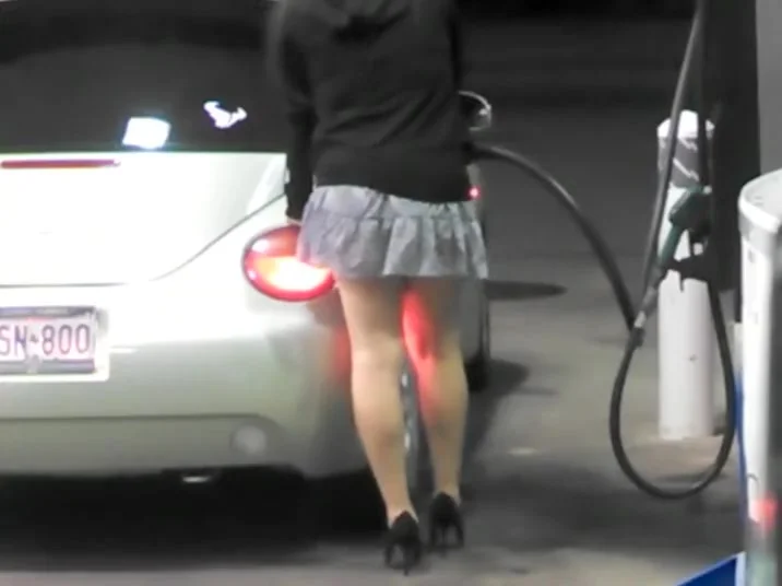 Luxurious babe on the gas station